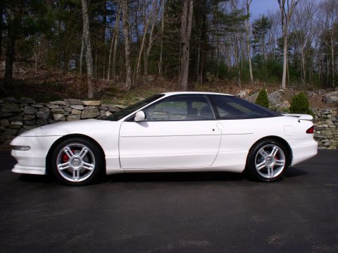 1996 Ford Probe - Side profile of a white 1996 Ford Probe GT shows its sporty coupe design.