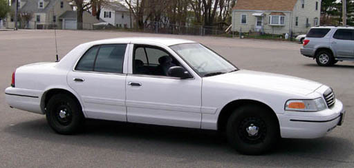 White 1999 Ford Crown Victoria sedan, 3q front view
