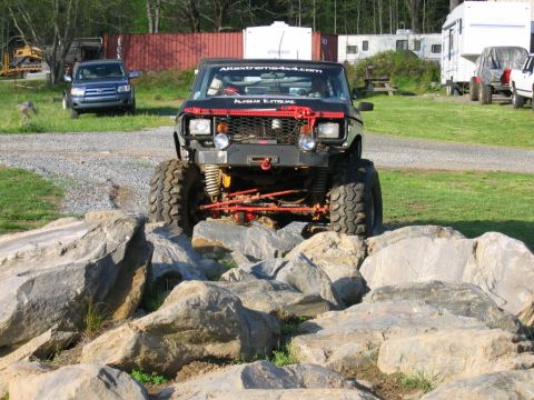 1992 Ford Mustang - An extreme off-road vehicle is shown navigating a rocky obstacle course.