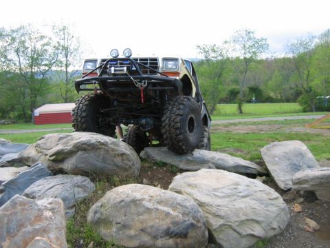 1992 Ford Mustang - Customized off-road truck navigating a rocky obstacle course.