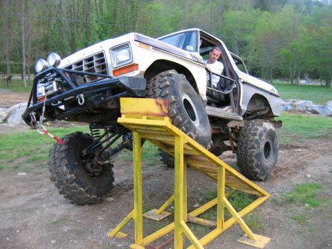 1992 Ford Mustang - This heavily modified 1979 Ford truck is positioned on a yellow ramp, its off-road capabilities.