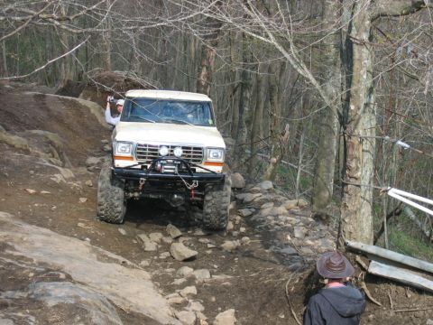 1992 Ford Mustang - A heavily modified 1979 Ford Bronco navigates a challenging off-road course.