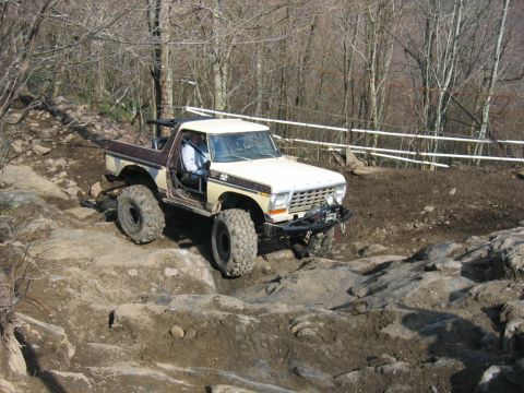 1992 Ford Mustang - This heavily modified 1978 Ford Bronco navigates a challenging rocky course, its off-road capabilities.