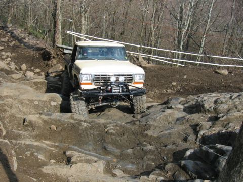 1992 Ford Mustang - This modified Ford F-Series pickup navigates a challenging off-road course.