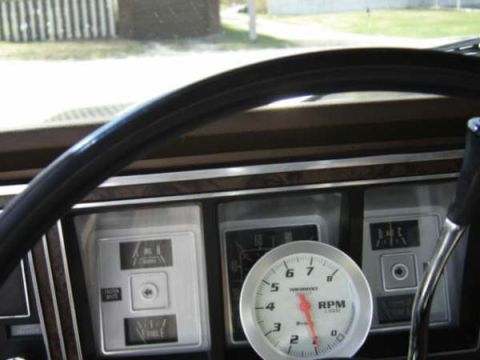 1979 Ford Bronco - Interior view of a 1979 Ford Bronco dashboard, a tachometer and various gauges.