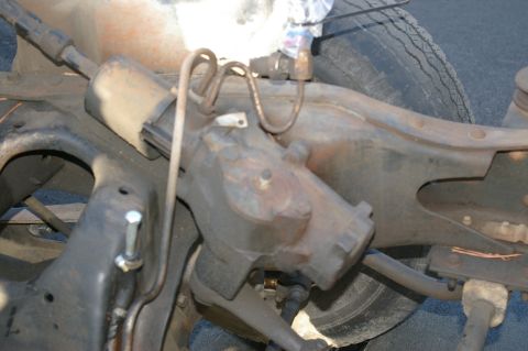 1986 Ford Bronco - Close-up view of a power steering gearbox assembly, likely from an older vehicle, showing signs of rust and wear.
