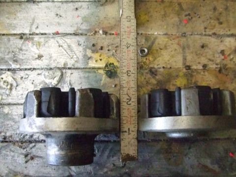 1995 Ford Mustang - A ruler measures two suspension components, likely for comparison or identification purposes.