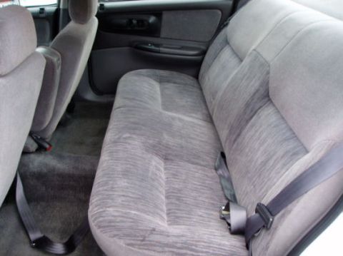 1997 Dodge Intrepid - Picture of identical car, back seat. (our ashtrays are missing though, and there are kid's stickers on the right rear window half-peeled of…