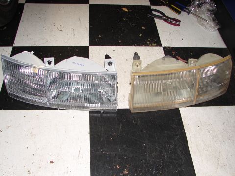 1992 Ford Taurus - A comparison of a new headlight assembly next to an older, yellowed one.