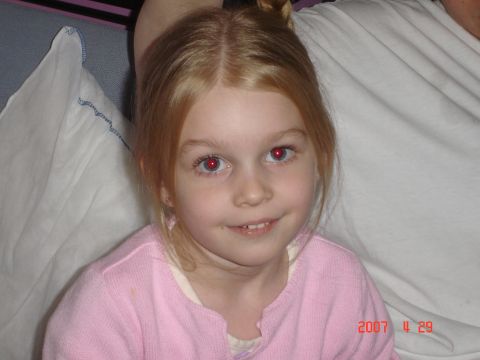 1993 Ford Bronco - A young girl with blonde hair and red eyes smiles at the camera, with a watermark indicating the photo was taken on November 29, 2007.