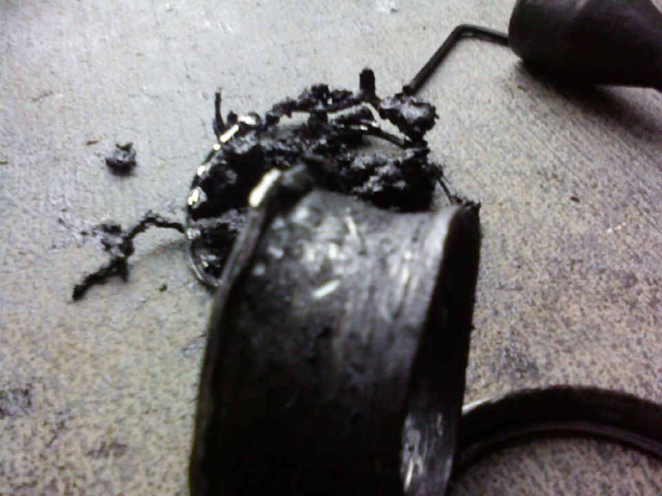 damaged fuel pump assembly on concrete floor