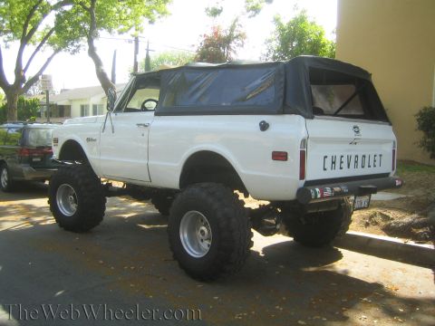 1968 Ford Mustang - This lifted 1972 Chevrolet K5 Blazer features a soft top and prominent "CHEVROLET" badging on the tailgate.