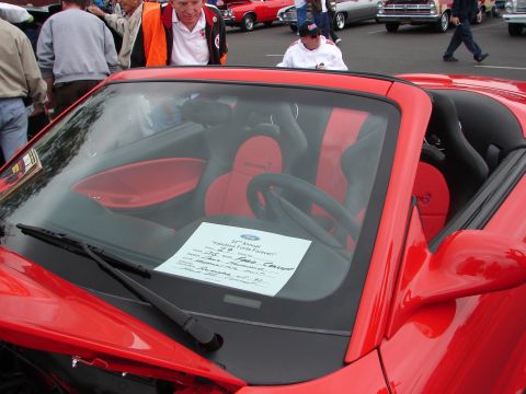 1992 Ford Taurus - A sign on the dashboard of a red convertible details its entry into the 22nd Annual "Fabulous Fords Forever" event.