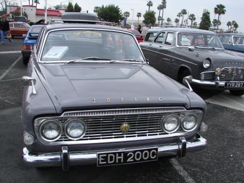 1992 Ford Taurus - A gray Ford Zodiac sedan is parked in a lot, with other vehicles visible in the background.