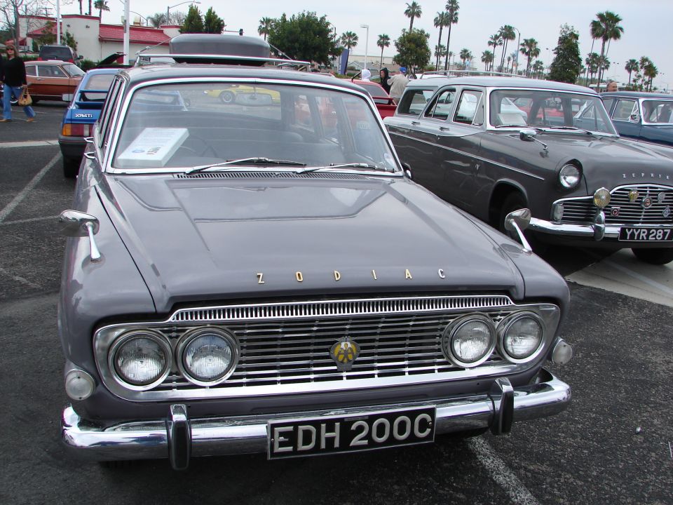 Gray Ford Zodiac sedan with chrome grille and dual headlights, parked outdoors