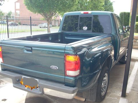 1998 Ford Ranger - Rear view of a green 1998 Ford Ranger pickup truck parked outdoors.