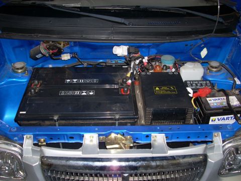 1992 Ford Bronco - The engine bay of an electric vehicle, showing the battery configuration and associated wiring.