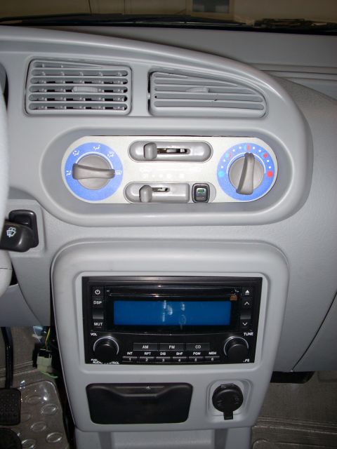 1992 Ford Bronco - Interior view of a car's dashboard, showing the climate control panel and radio.
