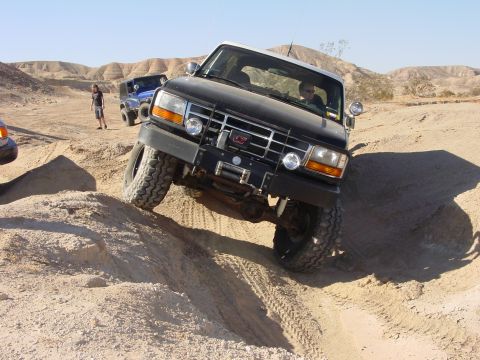 1994 Ford Bronco - 1994 Ford Bronco navigating challenging terrain off-road.