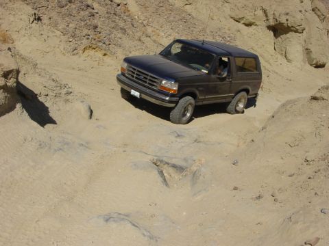 1994 Ford Bronco - This 1994 Ford Bronco navigates a challenging off-road path.