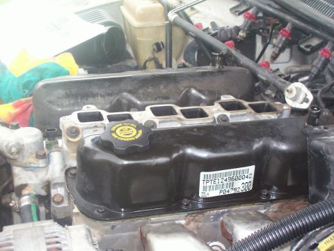 1997 Dodge Intrepid - Driver's side view of engine top end with plenum, TB, intake hose removed. The fuel rail is now out of the way as well.