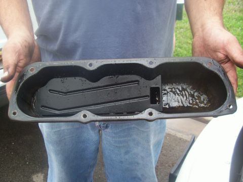 1997 Dodge Intrepid - Me holding the passenger side valve cover, showing repugnant goo.