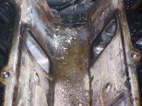1997 Dodge Intrepid - Closeup of the gritty silty crud sitting in the valley pan.