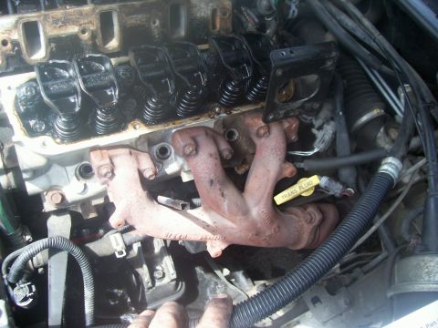 1997 Dodge Intrepid - Exhaust manifolds after heat shield removal. You can also see the missing dipstick, but you can't see the cigarette filter 2 inches down. A…