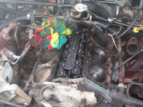 1997 Dodge Intrepid - Heads are off, general engine view, you can see all the lifters now, as well as the passenger side front piston being relatively clean comp…