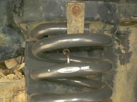 1986 Ford Bronco - A close-up view shows a Rancho brand suspension coil spring with part number N50C.