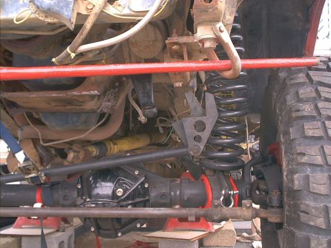 1986 Ford Bronco - The image displays the complex undercarriage of a vehicle, focusing on its suspension and drivetrain systems.