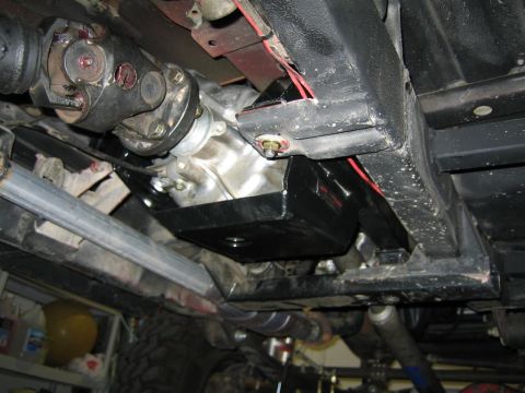 1987 Suzuki Samurai - Close-up of vehicle undercarriage showing transmission and driveshaft assembly.