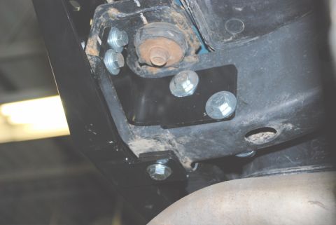 1996 Ford Bronco - Underside view of vehicle chassis components, including bolts and exhaust system.