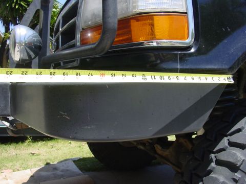 1994 Ford Bronco - A tape measure is placed across the front bumper of a black Ford Bronco, indicating a width of 12 inches.