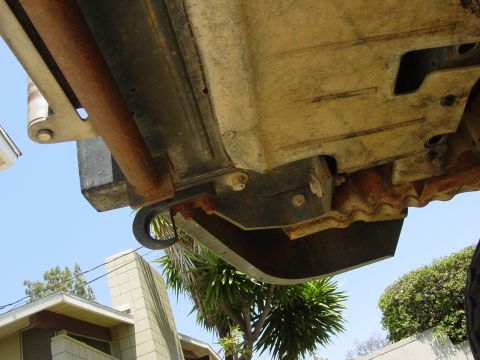 1994 Ford Bronco - Close-up view of the undercarriage, focusing on the tow hook and frame structure.