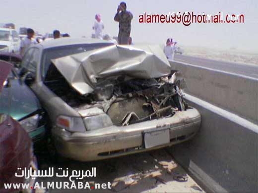 Front view of a wrecked 1999 Mercury Grand Marquis, gold color