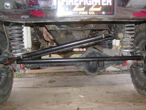 1991 Ford Bronco - The photo shows the undercarriage of a vehicle, focusing on the suspension and steering system.