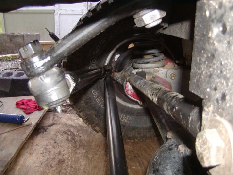 1991 Ford Bronco - Undercarriage view showing suspension parts and a tire.