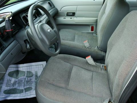 2003 Ford Crown Victoria - Interior view of a 2003 Ford Crown Victoria, front seats and steering wheel.