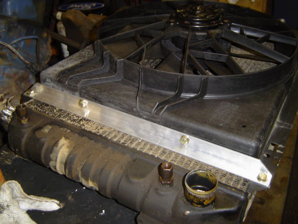 Radiator and fan shroud assembly sitting on a shop floor