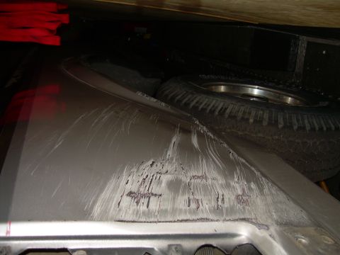 1986 Ford Bronco - A damaged car fender and a spare tire are visible in the image.