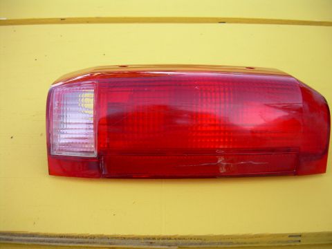 1986 Ford Bronco - This red taillight assembly features a clear section for the reverse light.