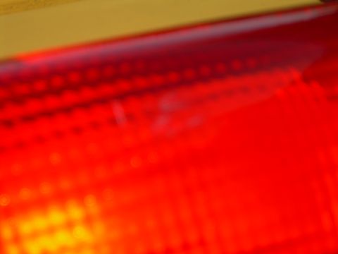 1986 Ford Bronco - A close-up view of a vehicle's red taillight assembly.