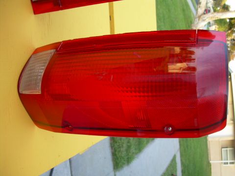 1986 Ford Bronco - Close-up of a red car taillight assembly, likely a replacement part.