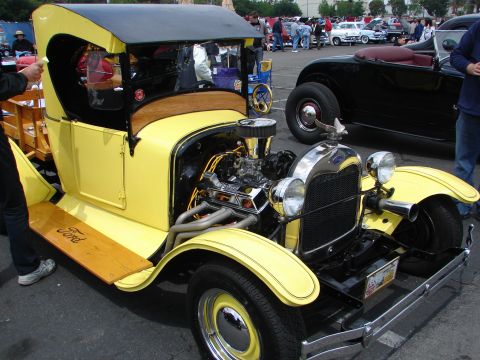 1992 Ford Taurus - This yellow 1928 Ford hot rod truck features an exposed V8 engine and wooden running boards.
