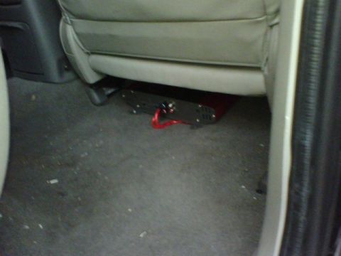 2003 Toyota Tacoma - An aftermarket car amplifier is installed beneath the passenger seat.