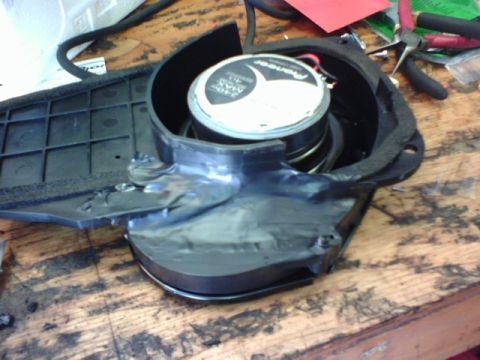 2003 Toyota Tacoma - A Pioneer speaker assembly is shown with a broken plastic mounting bracket.