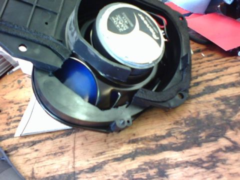 2003 Toyota Tacoma - A speaker with a Pioneer logo and a blue cone is shown, likely removed from a vehicle's stereo system.