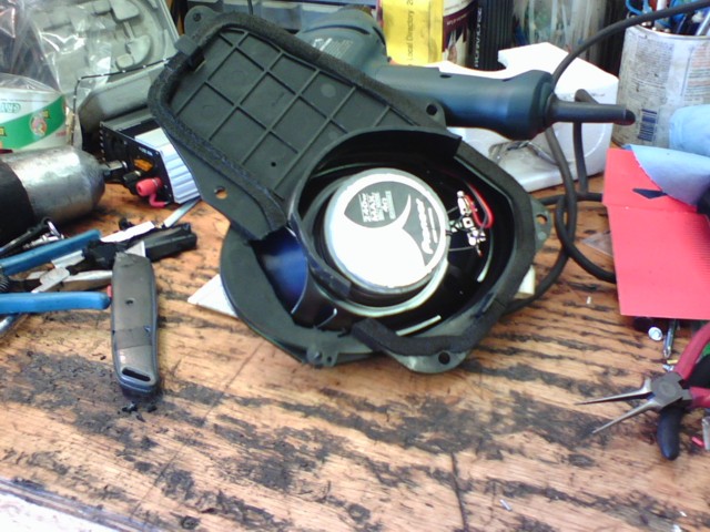 Pioneer car speaker assembly with wiring and mounting bracket on a wooden workbench