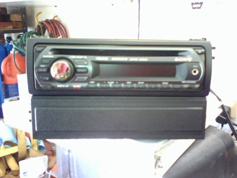 2003 Toyota Tacoma - A Sony car stereo unit is shown, a central display, control buttons, and an auxiliary input jack.